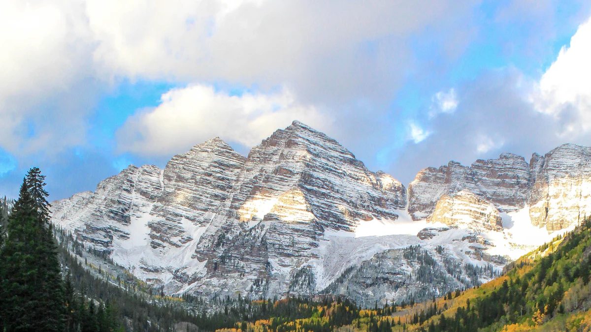 Aspen sits among mountain slopes and autumn trees.