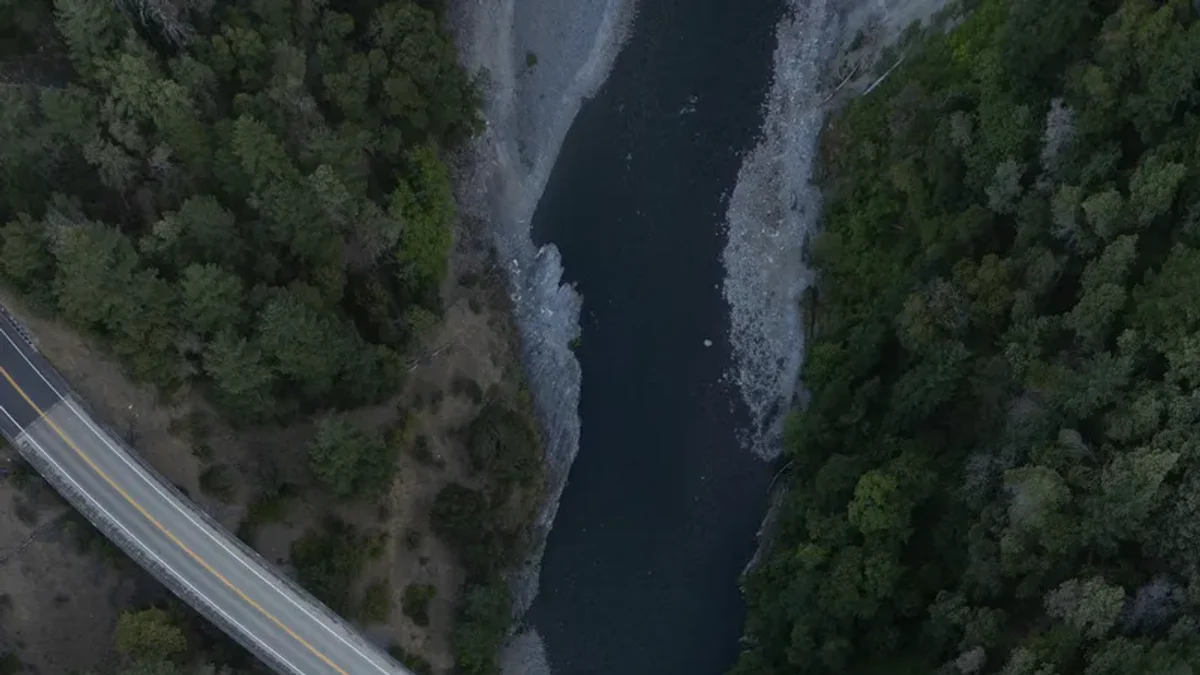 Highway 3 crosses the Trinity River amid the forested mountains near Weaverville.