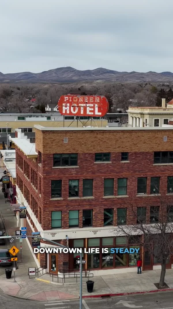 The red Pioneer Hotel sign tops a brick building in downtown Elko.