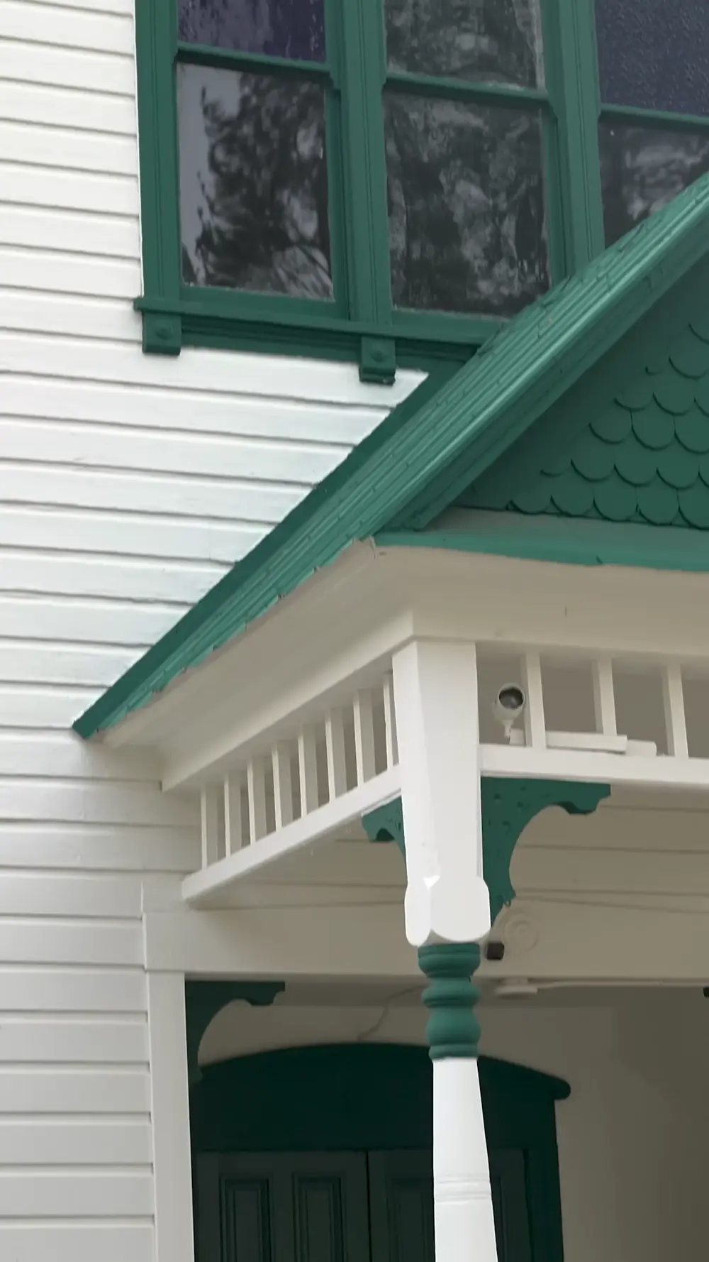White clapboard building and green staircase in Dutch Flat.