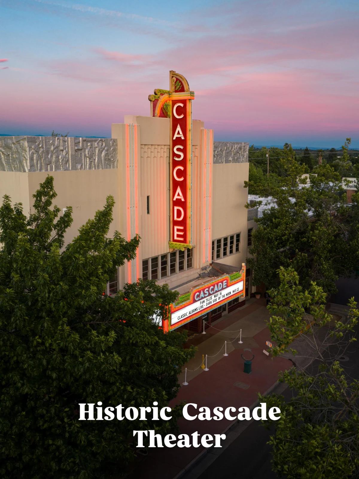 The illuminated Cascade Theatre sign above downtown Redding